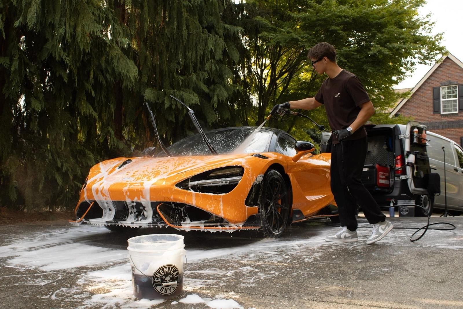 Foam wash on a McLaren 765LT in a Clark County driveway — the van and crew on site